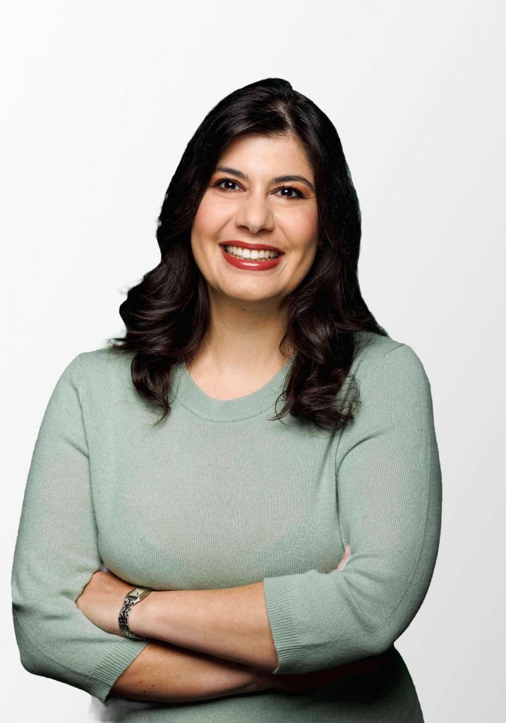 Portrait of Derya Karadag on a gray background